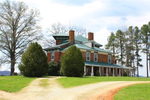 The Real Porch of Fairview faces Lowesville Road and is surrounded by a vast pastoral landscape.